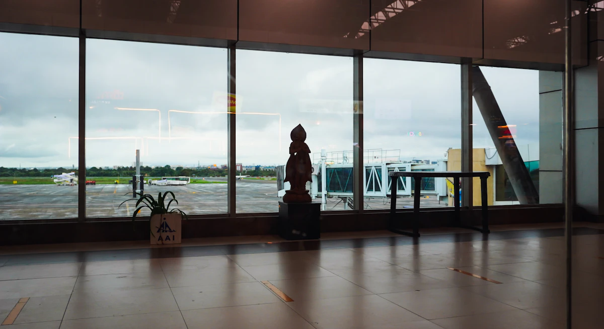Amex Centurion Lounge interior with runway views and premium seating